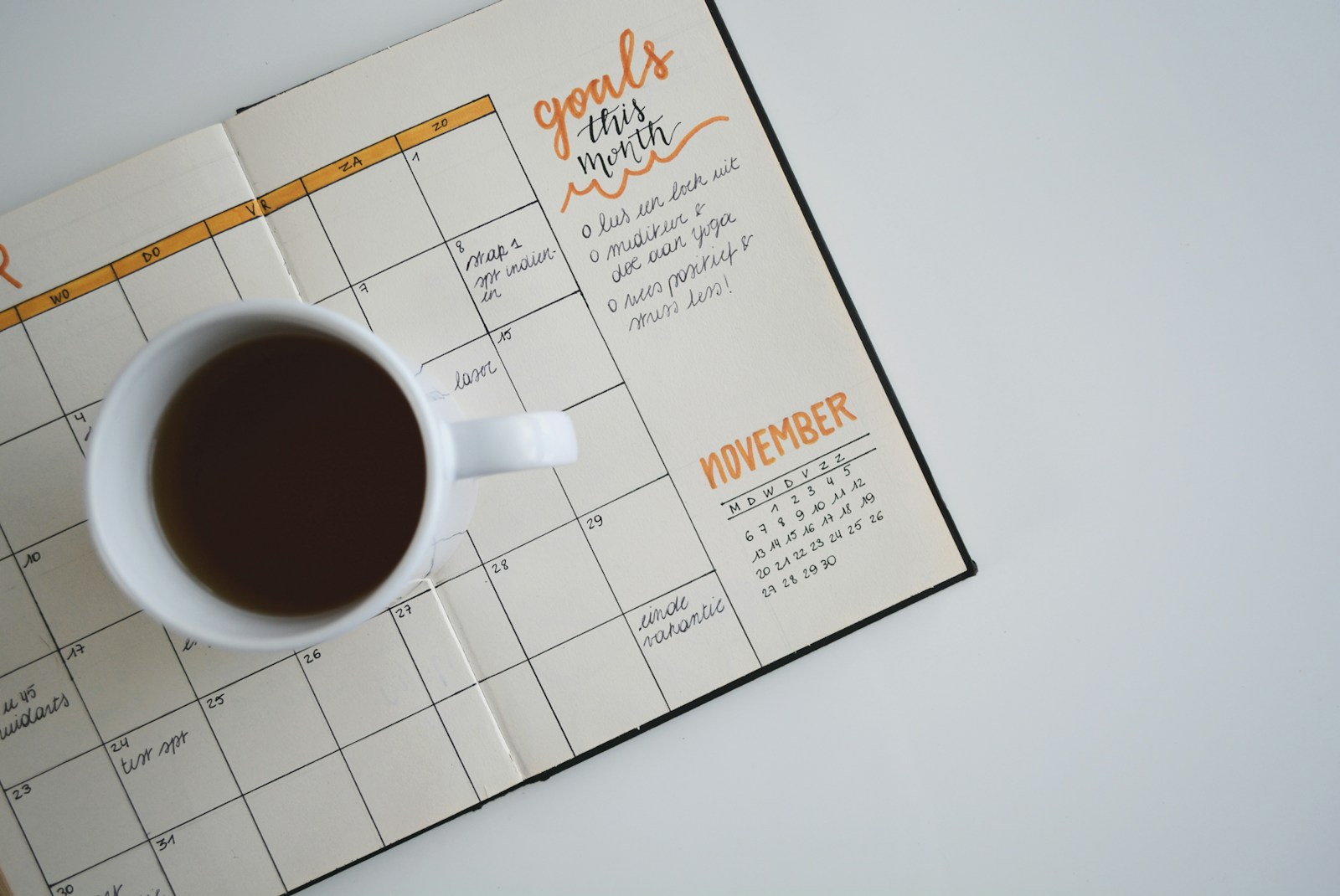A notebook with weekly numbers written in it